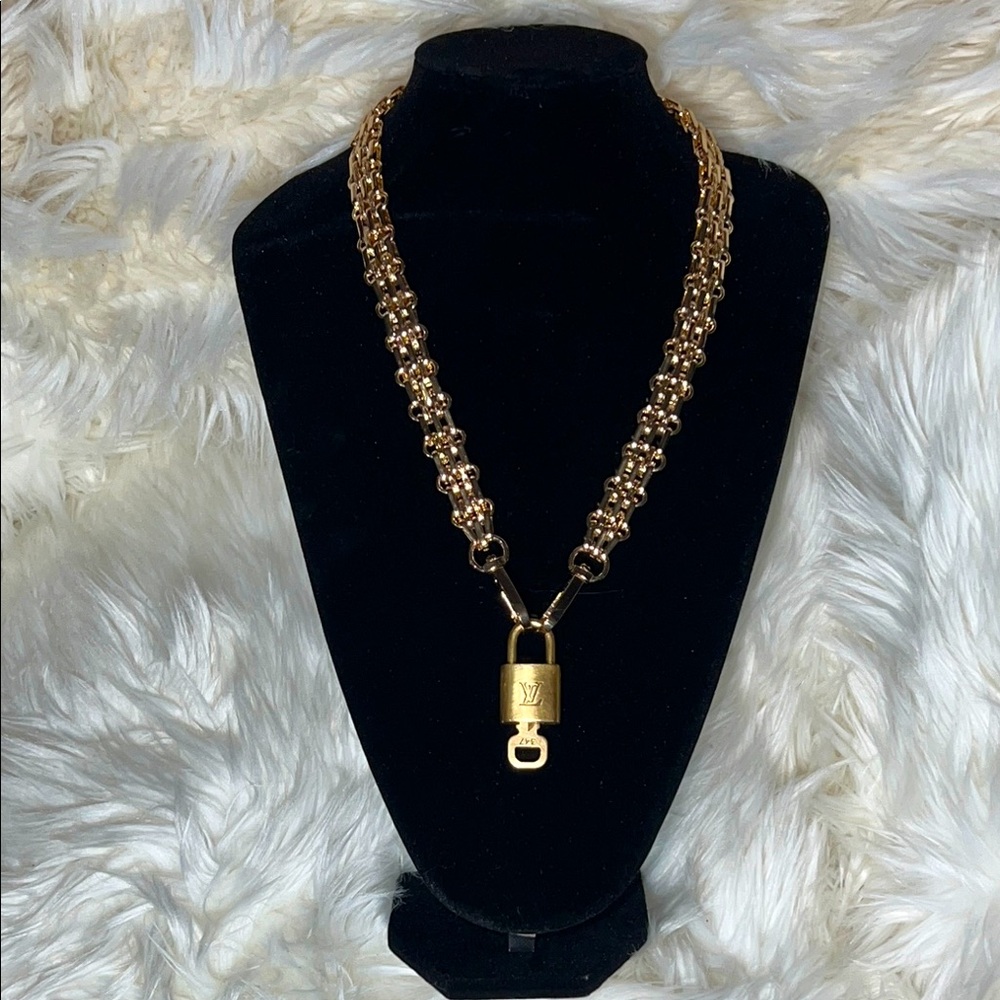 Authentic Louis Vuitton padlock with key and generic necklace